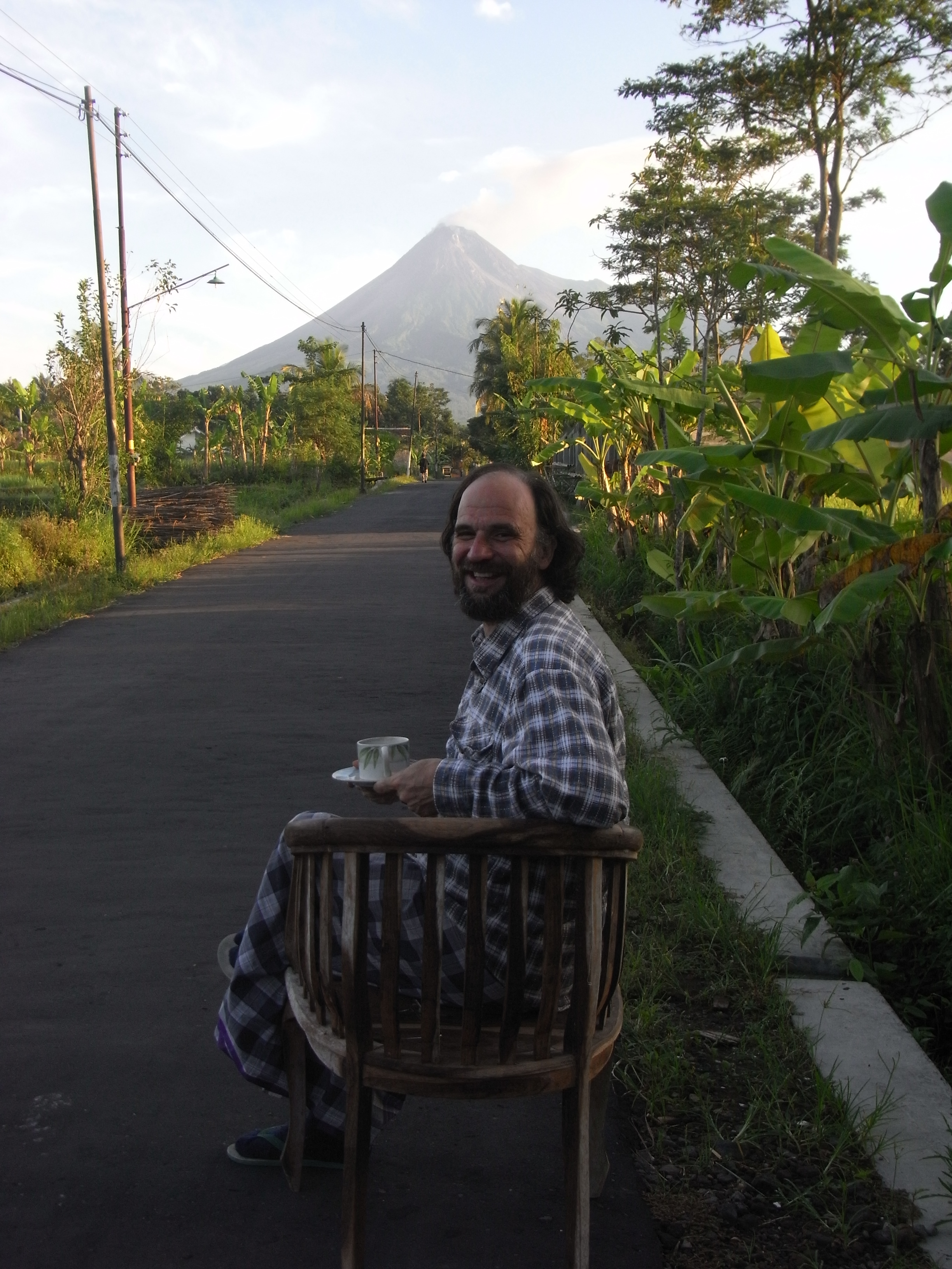 Coffee with Gunung Merapi in the quiet early morning road in front of Kartika's place.