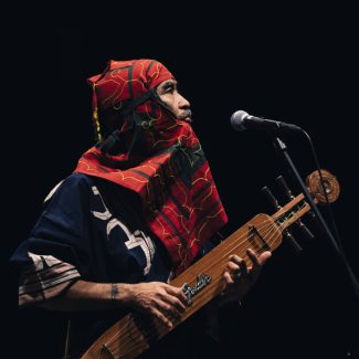 Oki Kano with his tonkori - Photo by Maciej Komorowski