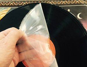 Cleaning a vinyl LP: Peeling the dried glue off in one piece